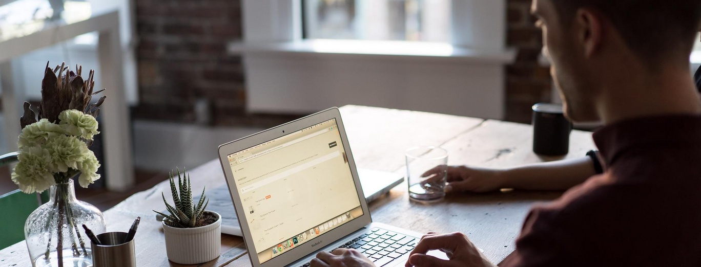 Man coding at a laptop